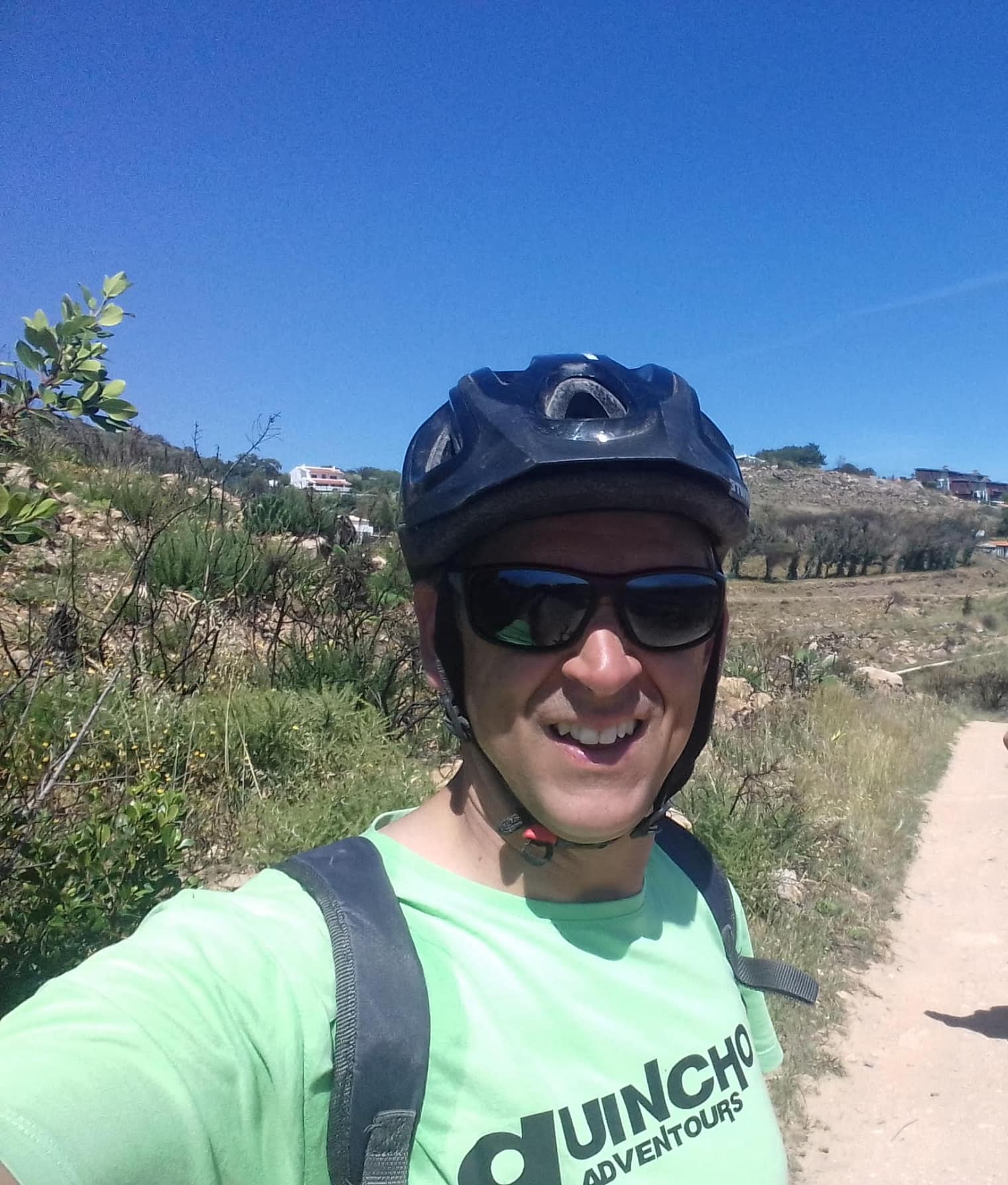 Arlindo — owner and lead guide, on the trail in a Guincho Adventours shirt